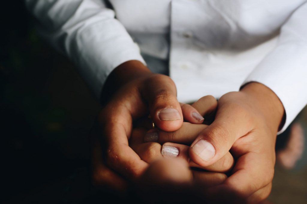 A couple holding hands to represent sex therapy for men