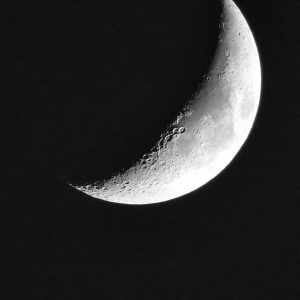 Photo of waxing half moon at night to represent Women's Moon Circle.