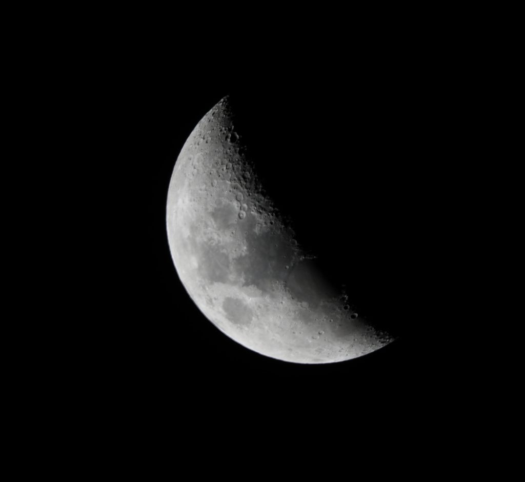 Photo of waning gibbous moon at night representing Women's Moon Circle.
