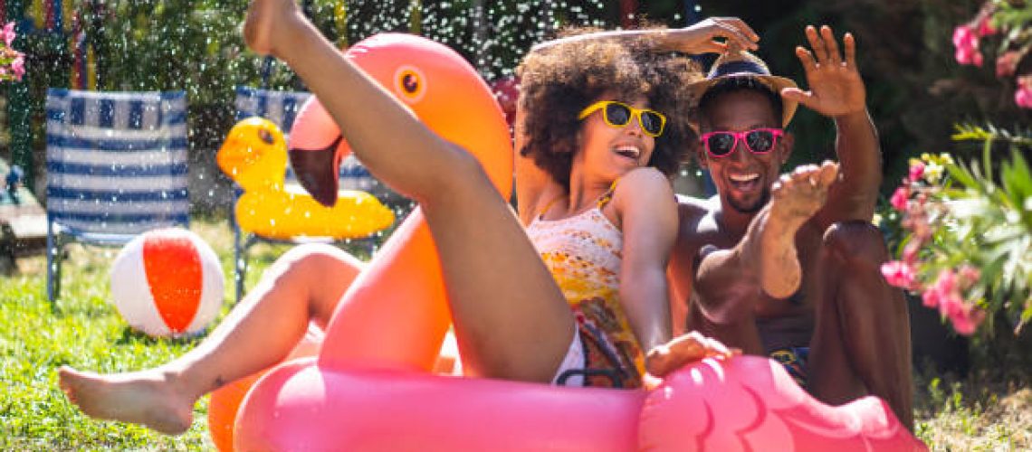 Young couple having fun on their vacation in the backyard