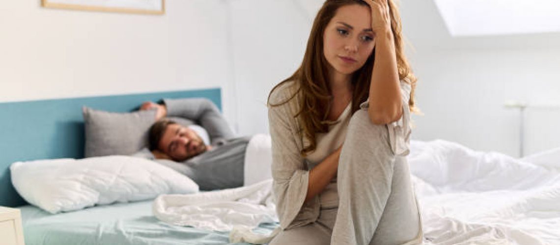 Upset woman thinking about relationship problems and lover indifference