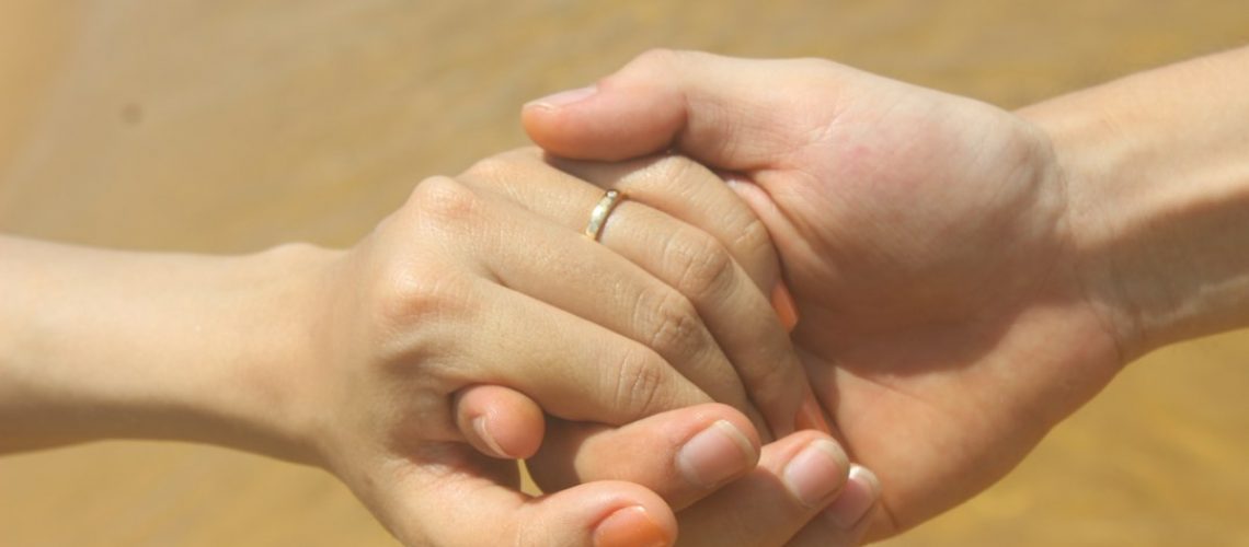 couple holding hands - relationship counseling for low libido in Woodland Hills